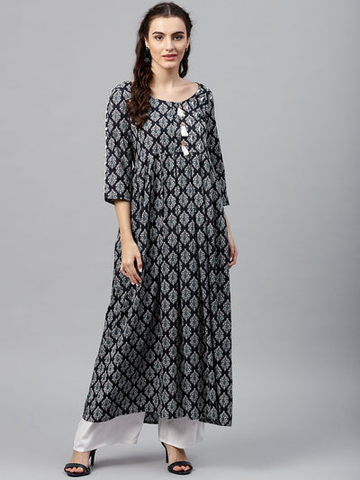 Round neck Black & white printed maxi dress with 3/4 sleeves and Emblished with tassels