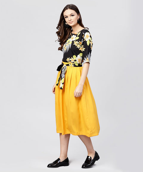 Black printed half sleeve tops with yellow calf length skirt with belt