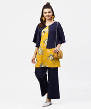 Yellow printed tunic with attached cape sleeves and V-neck