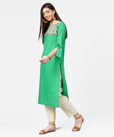 Green yoke printed half sleeve cotton kurta with cream ankle length pallazo