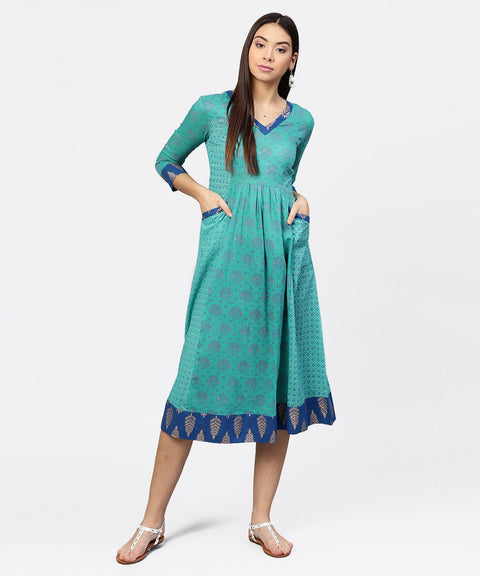 Printed V-neck panelled with patch pockets and 3/4th sleeved Maxi Dress