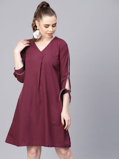 Burgundy A-line dress with knot style sleeves