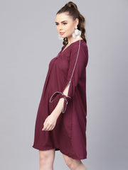 Burgundy A-line dress with knot style sleeves