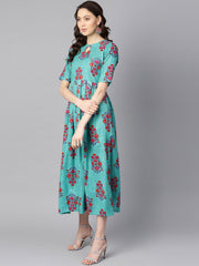 Turqish blue color printed half sleeve pleated maxi dress with deep back and tassel detailing.