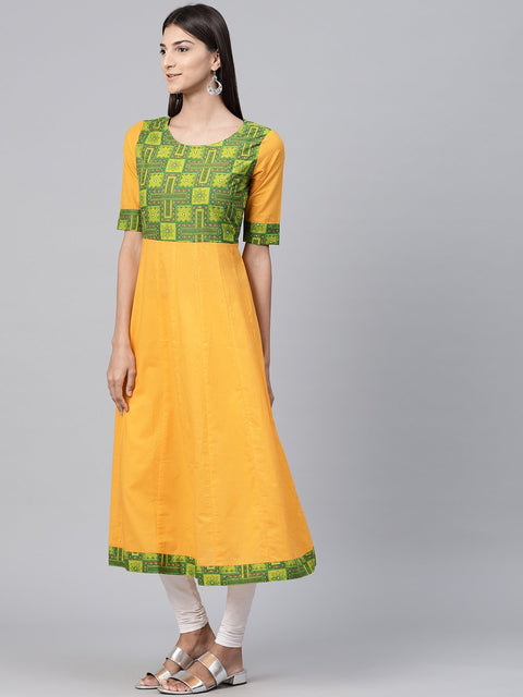 Yellow half sleeve cotton A-line kurta with printed yoke