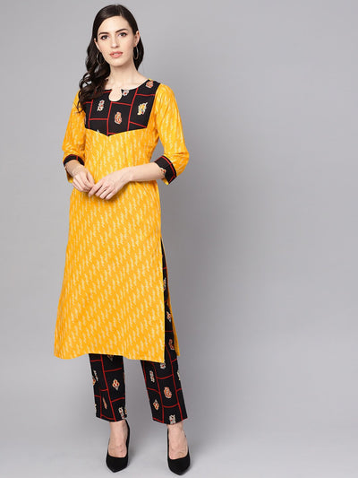 Yellow 3/4th sleeve cotton kurta with navy blue ankle length palazzo