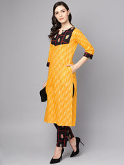 Yellow 3/4th sleeve cotton kurta with navy blue ankle length palazzo