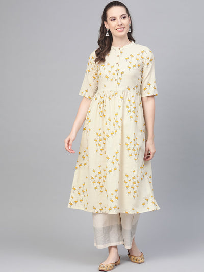 Off white and yellow ochre flamingo printed dress with a detachable belt detailing on the yoke